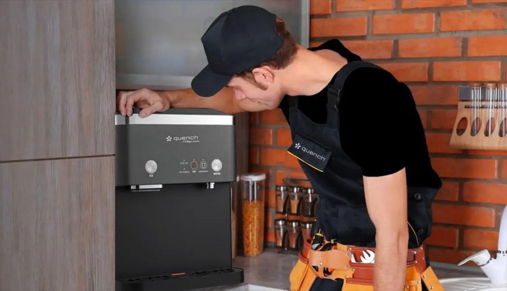 Quench maintenance tech working on water cooler